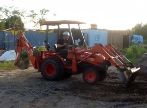Chris levelling the area for the last truck trailer 